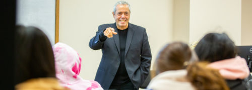 Professor talking to students in a classroom